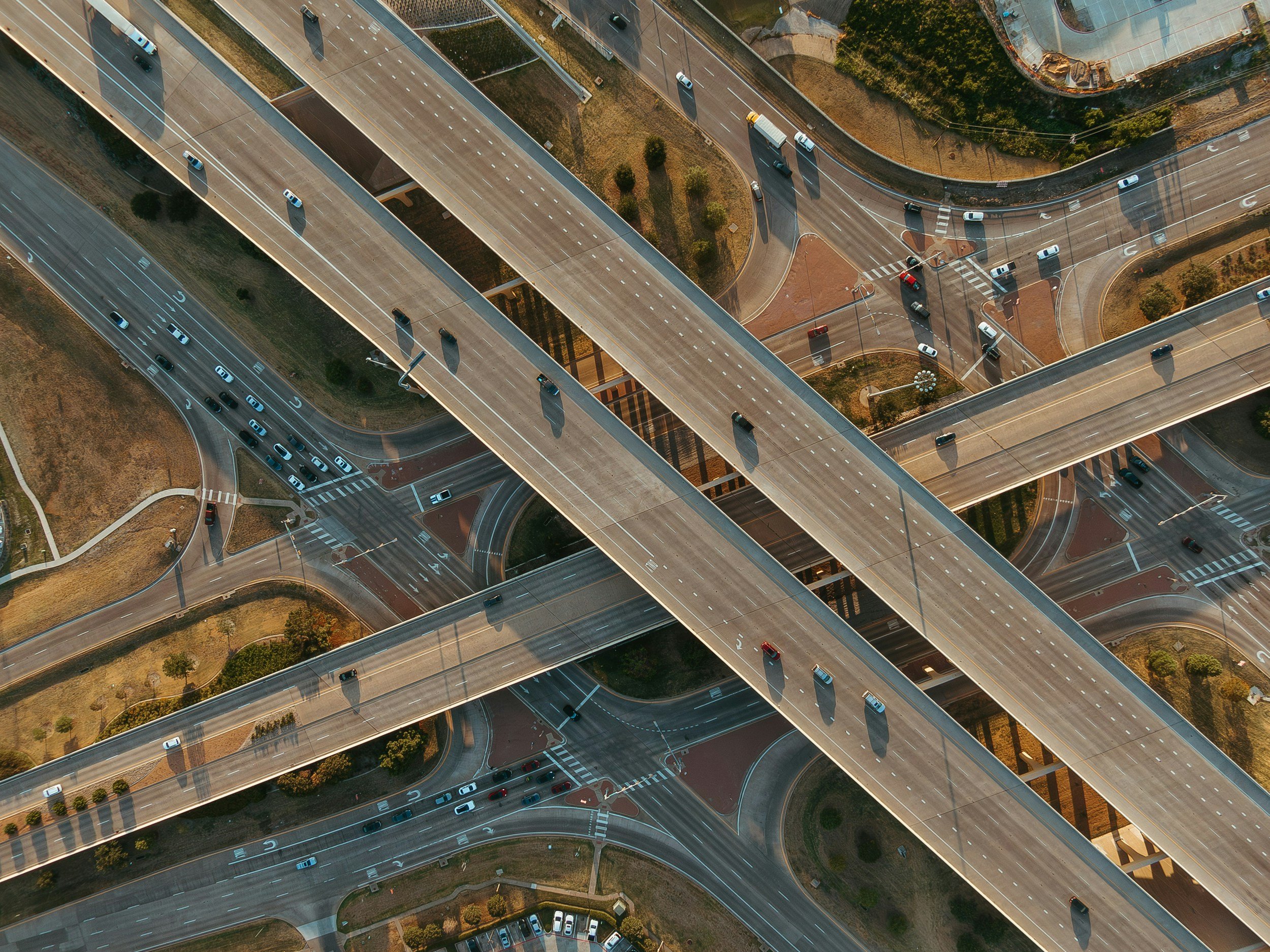 Aerial view of a Central Texas highway interchange in the Essential ADAS pickup and delivery area