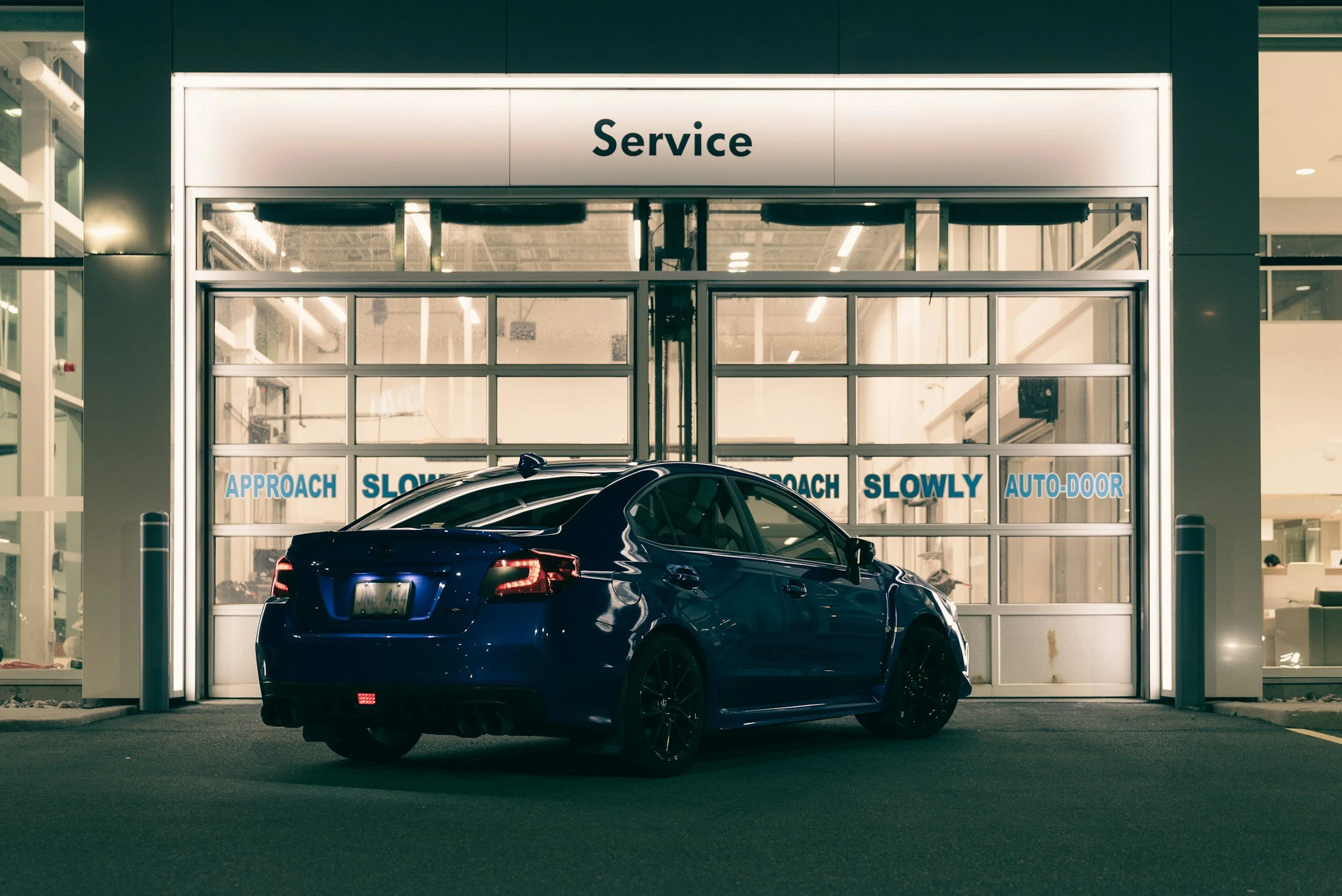 Vehicle parked outside a service bay, ready to be scheduled for ADAS calibration