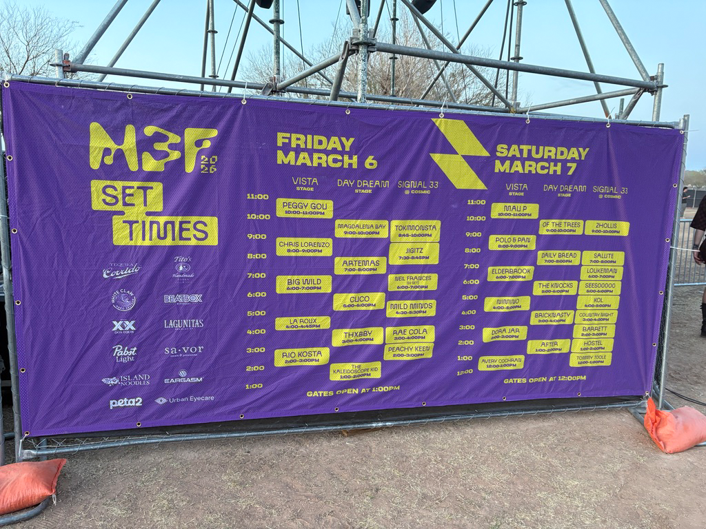 Schedule of performances at an outdoor music festival on purple stage banner, taking place on March 6 and 7, with various artist names and performance times listed.