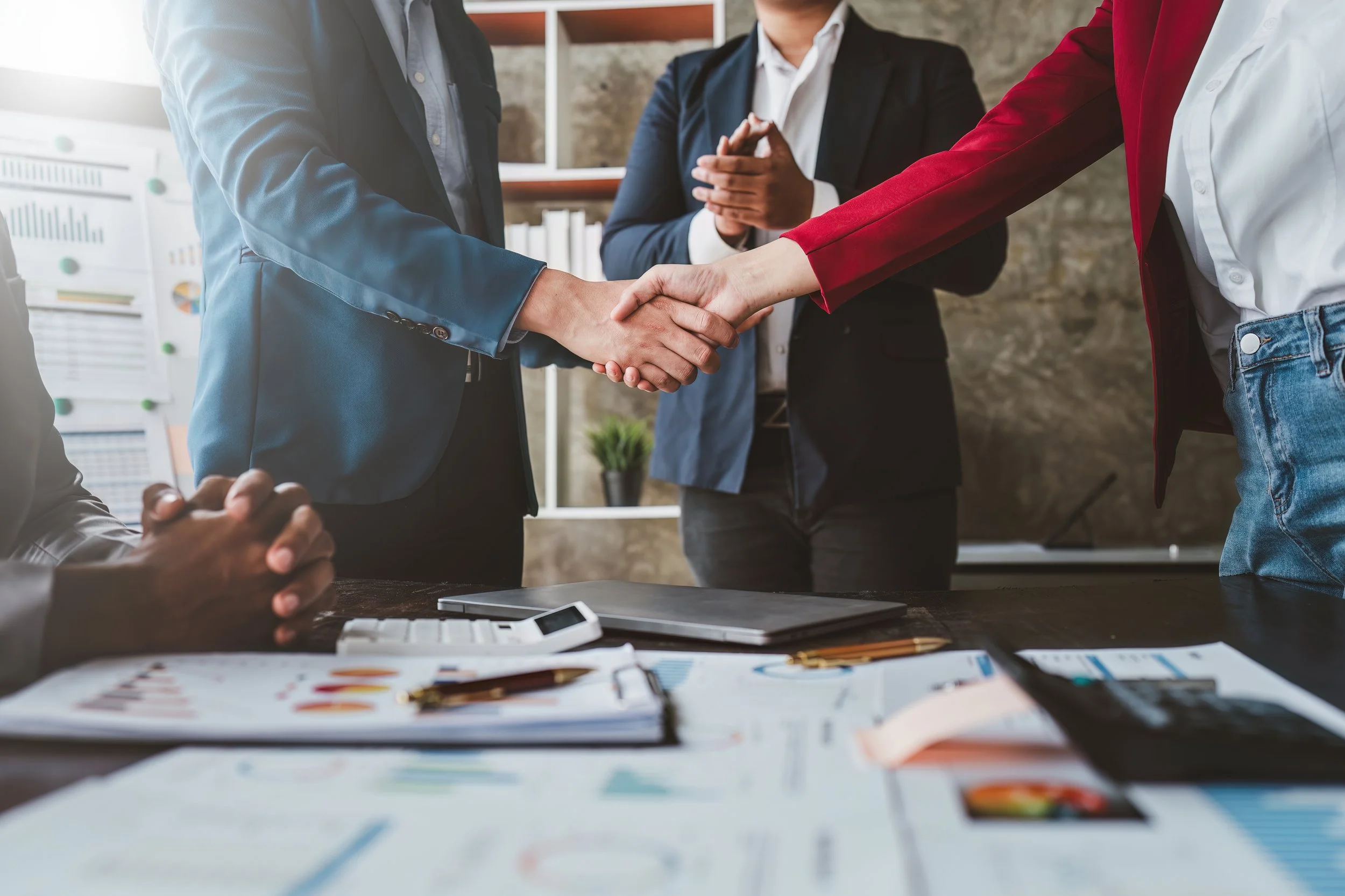 A team meeting and shaking hands