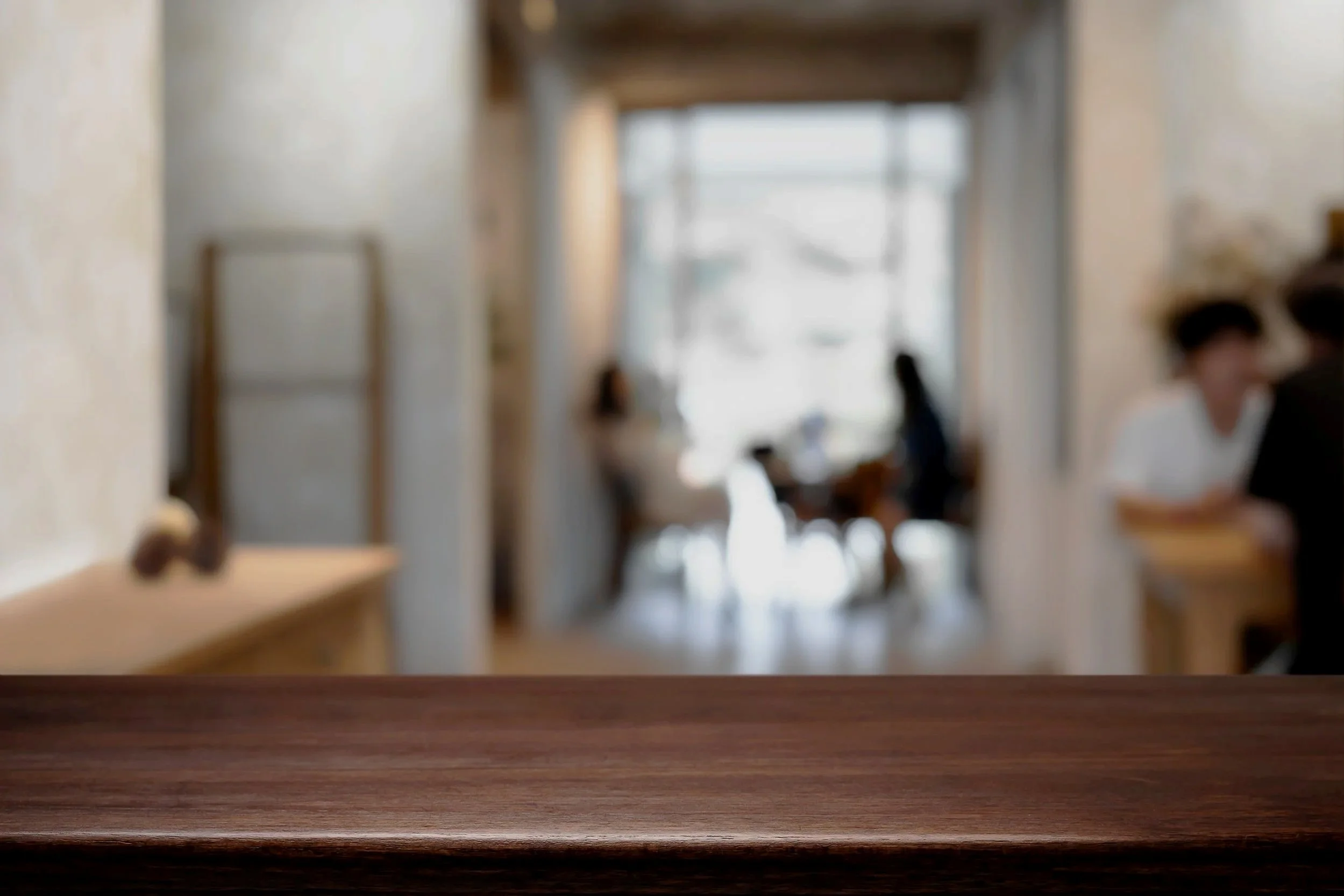 A decorative image of people meeting in the background