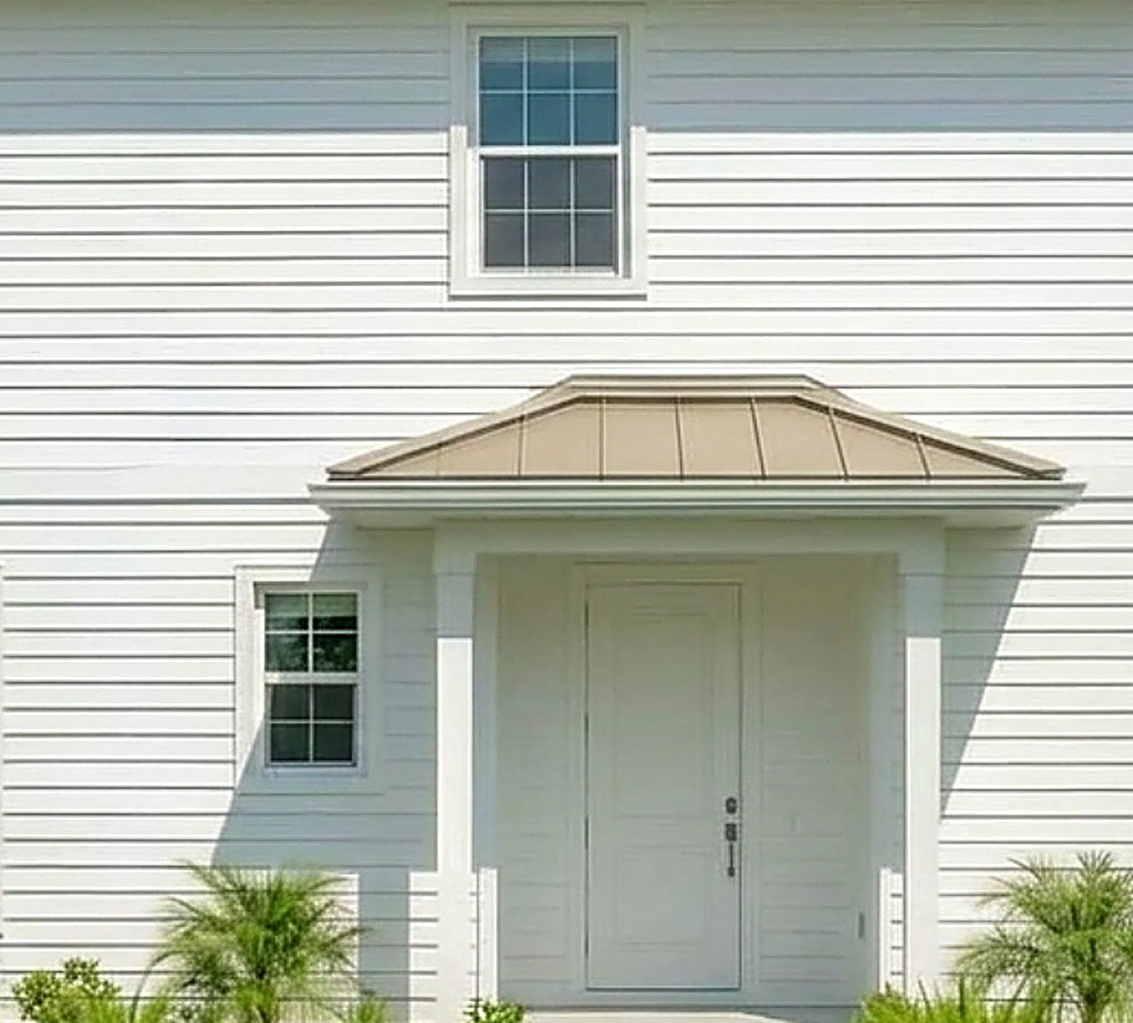 Soft washing completed for vinyl house siding and roof of house