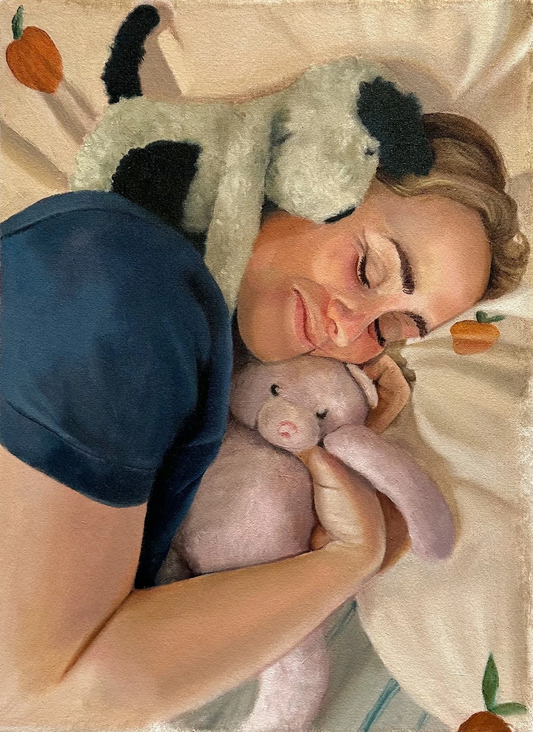 A woman lying on her side, smiling with her eyes closed, hugging her childhood stuffed animal.
