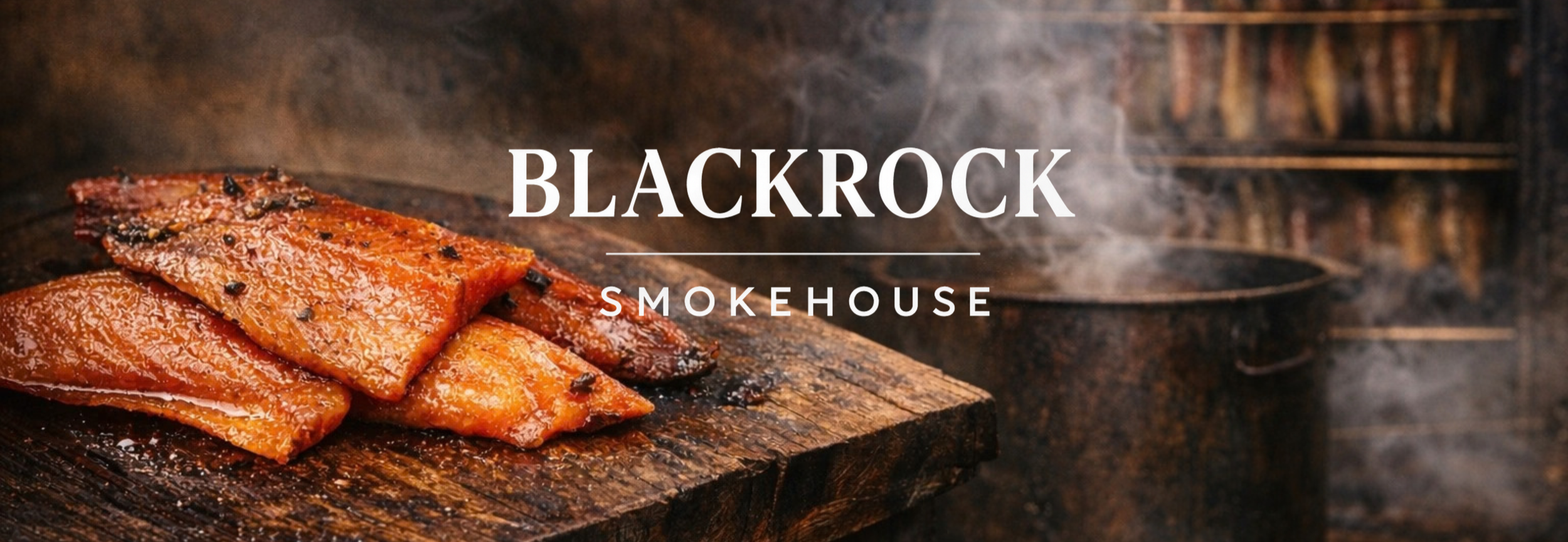 Barbecue smoked ribs on a wooden cutting board with smoke in the background at Blackrock Smokehouse.