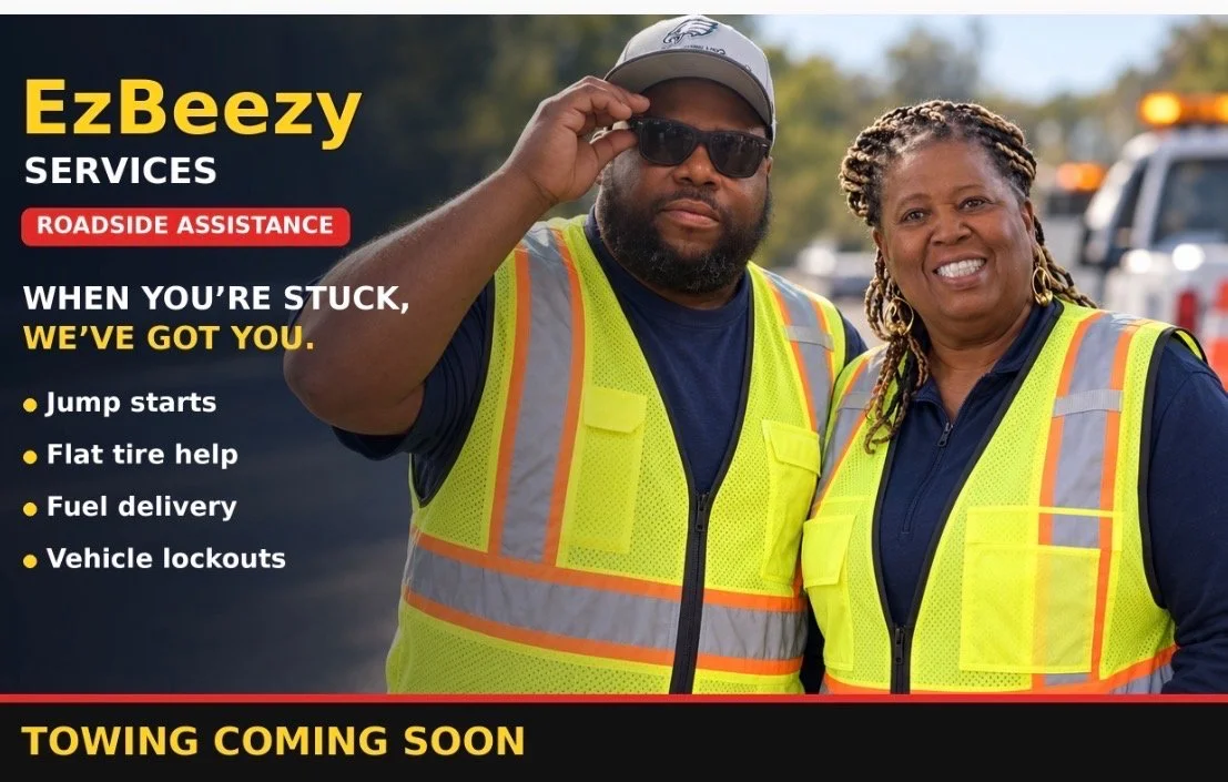 A man and woman standing outdoors in bright safety vests, smiling, with a roadside assistance service advertisement overlay. The ad lists services like jump starts, flat tire help, fuel delivery, vehicle lockouts, and announces towing soon.