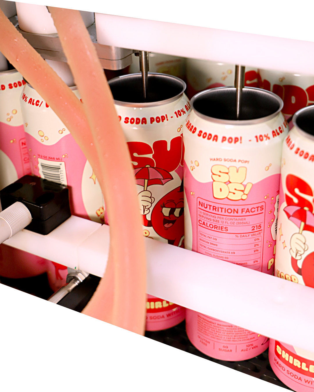 Cans of Shirley Temple hard soda with a pink label featuring a cartoon cherry character holding an umbrella, and a pink soda pop in the foreground.