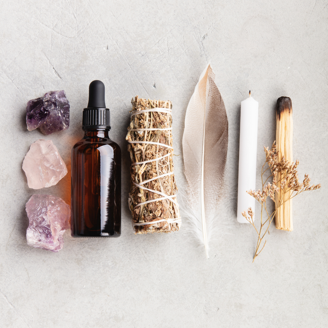 crystals, essence, sage, feather, candle, palo Santo