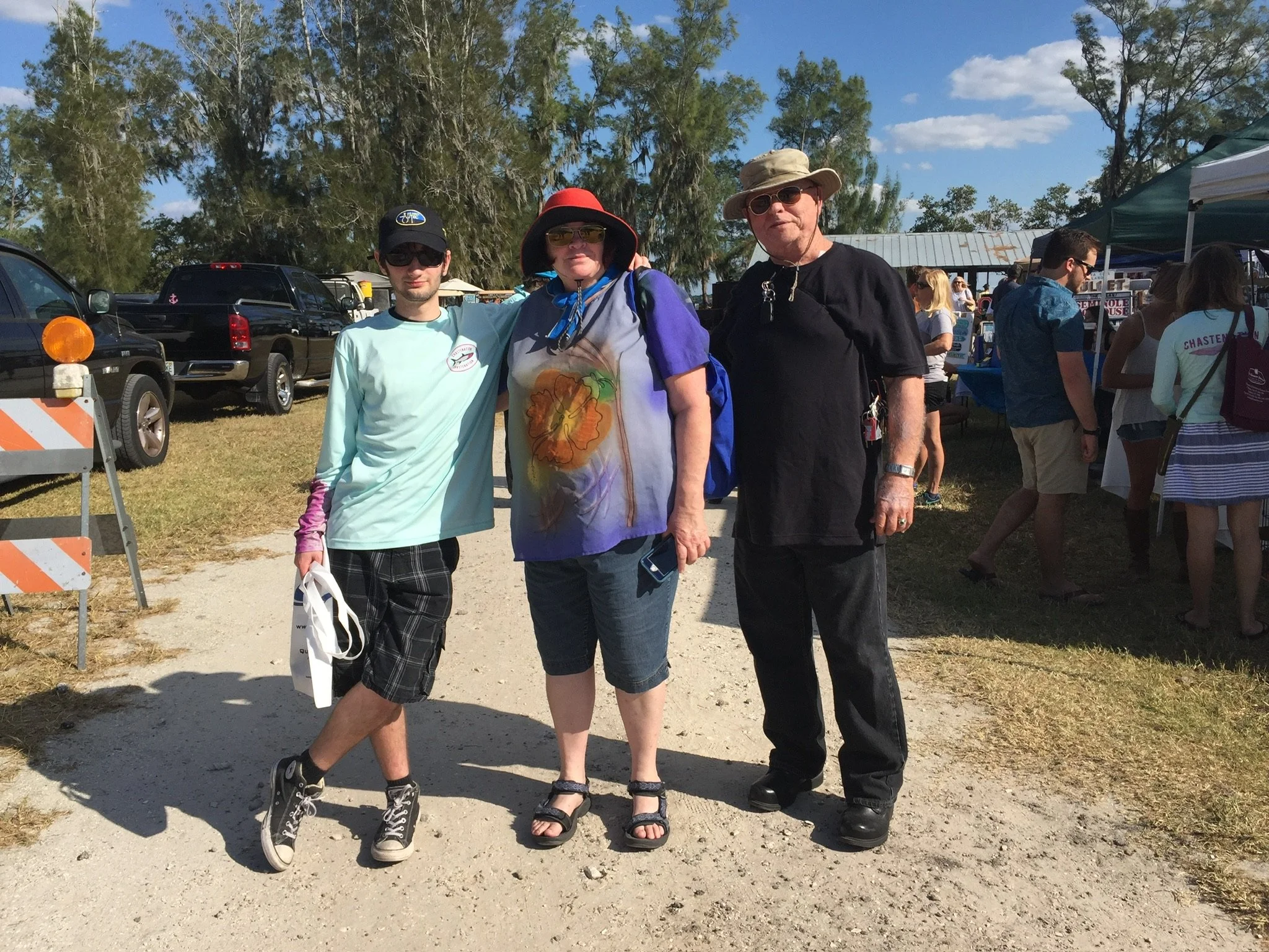 Ocean Fitts as a teenager with family at an outdoor festival