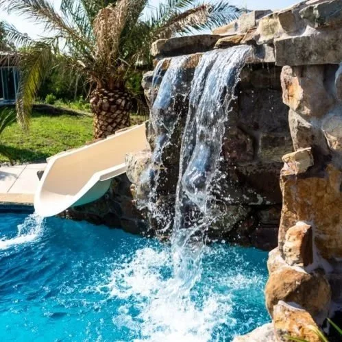 Pool add ons to really bring a normal pool to life waterslide and waterfall