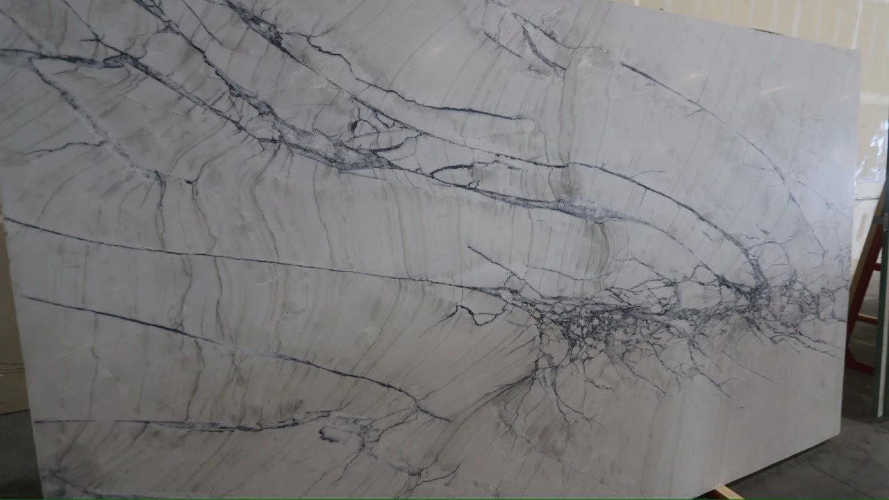 Large marble slab with white and black veining.