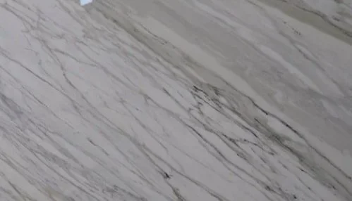 Close-up of a gray and white marble surface with natural veining.