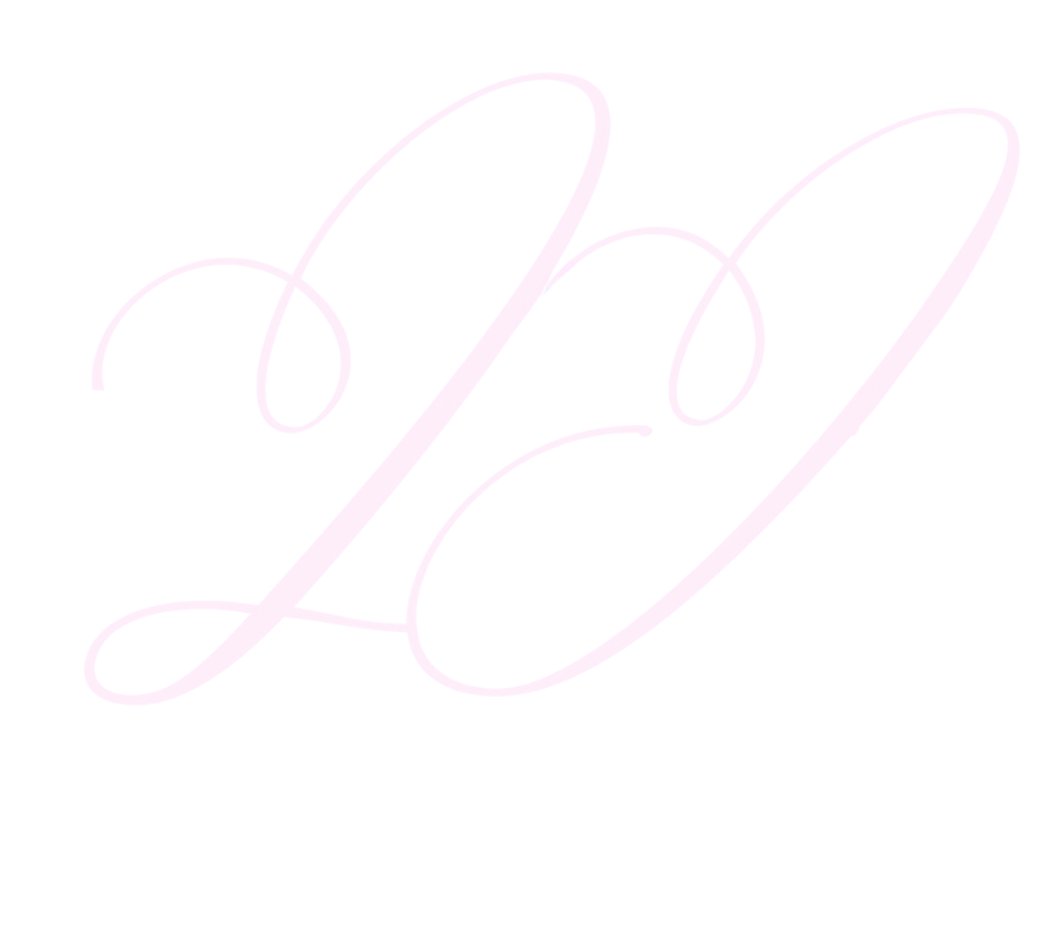 A pink neon light in cursive script spelling out the word 'Love' on a black background.