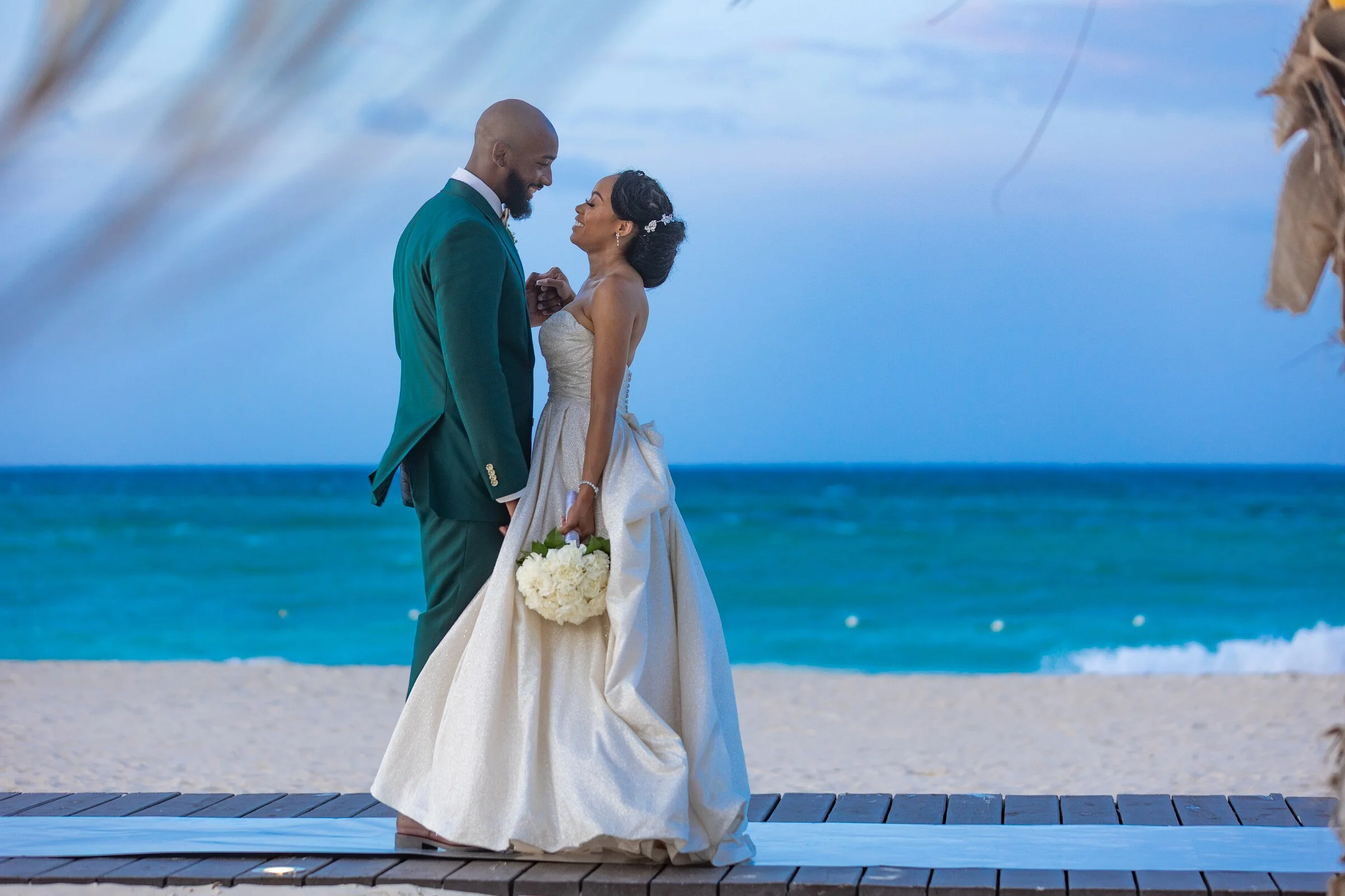 Ashley and Jahron sharing an intimate oceanfront portrait