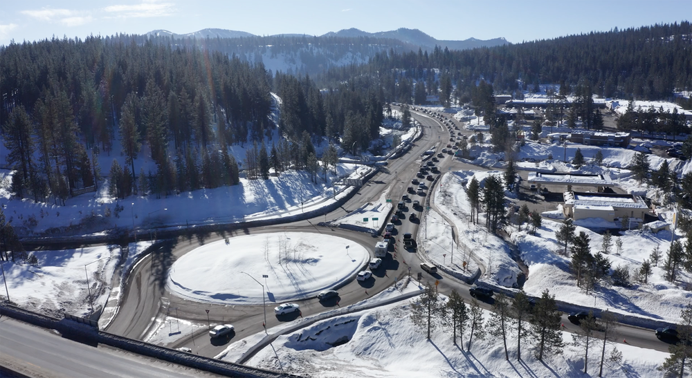 Aerial view of cars queued on the highway interchange in winter