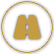 Gold road sign resembling a castle turret within a black circle