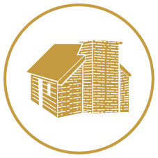 Golden outline of a small house with a chimney inside a black circle