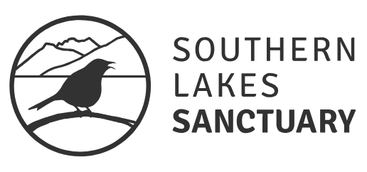 Logo for Southern Lakes Sanctuary featuring a black bird on a branch within a circular mountain landscape background.