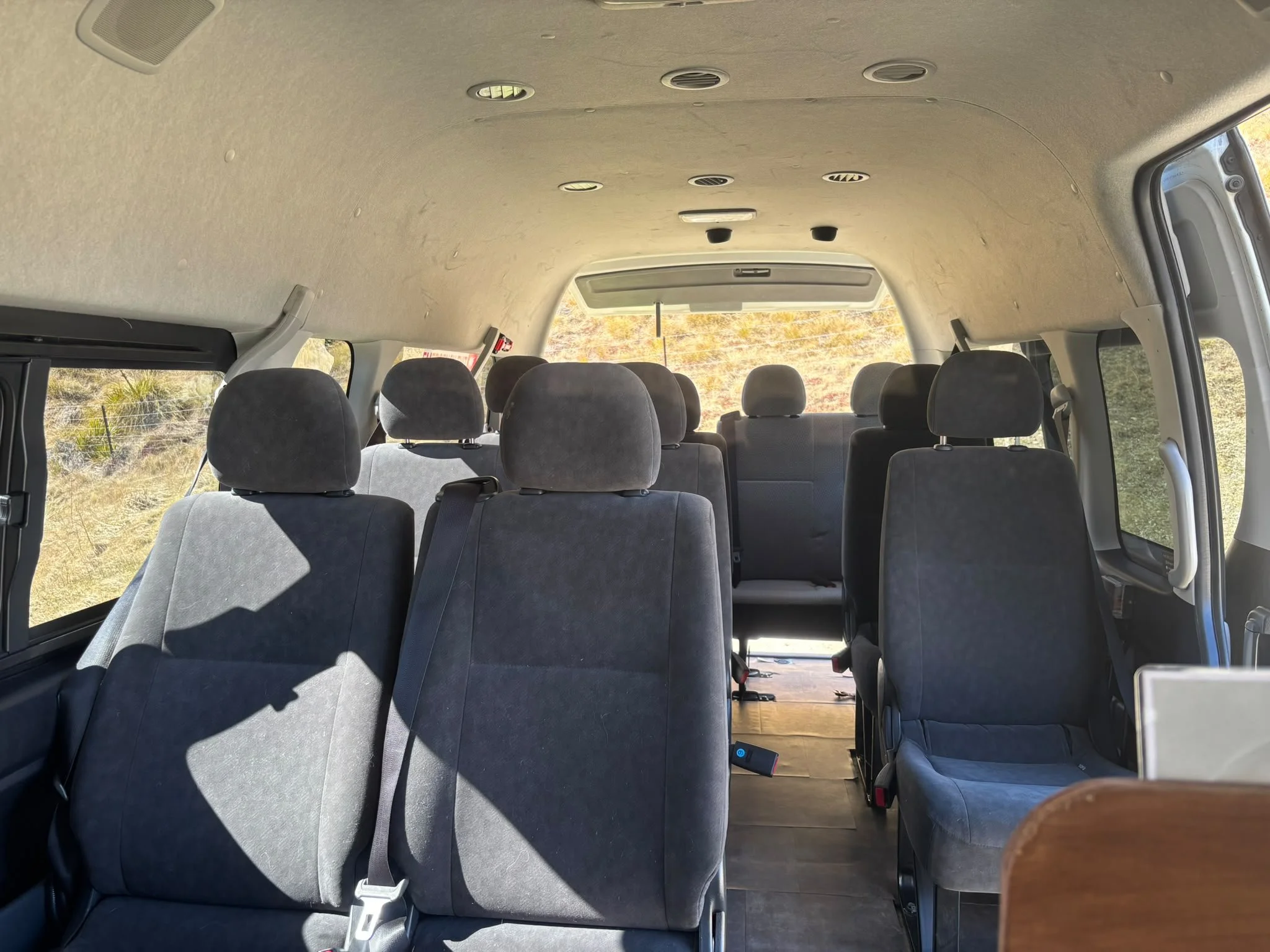 Passenger seating in rear of bus