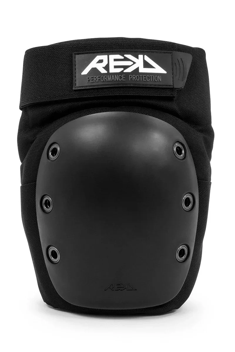 Black knee or elbow pad with a protective hard shell and a strap labeled 'REKD' for performance protection.