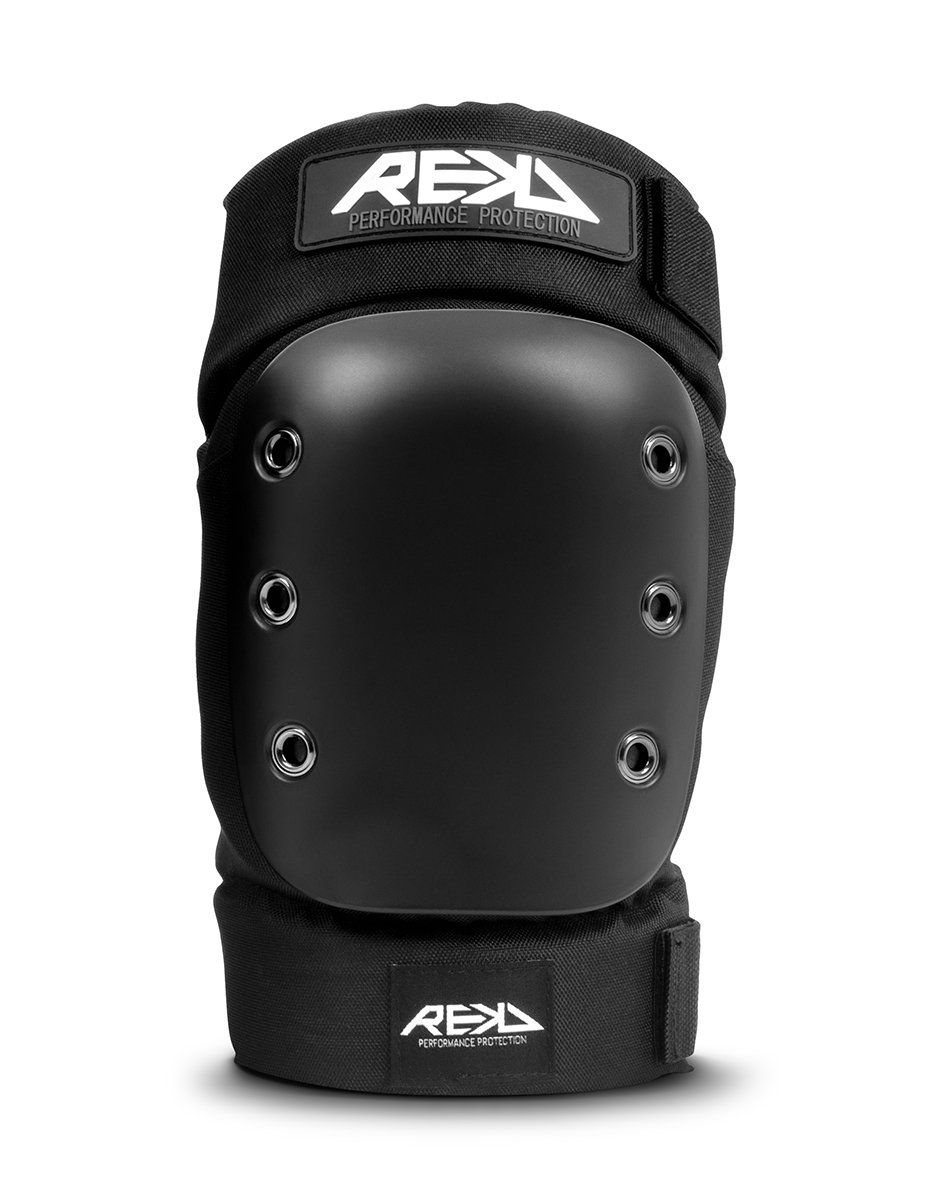 A black knee or elbow pad with six metal eyelets for ventilation, attached to a black fabric sleeve with a REKD logo patch at the top and bottom.