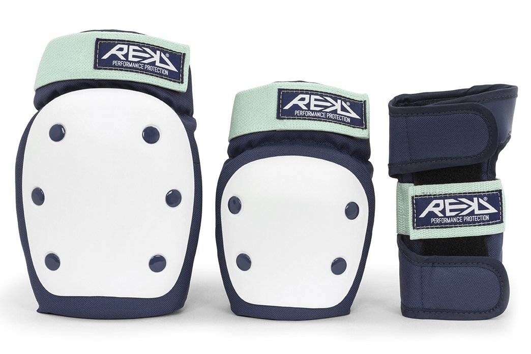 Pair of athletic knee pads and a wrist guard, navy blue with light green straps, branded REKD, designed for sports protection.
