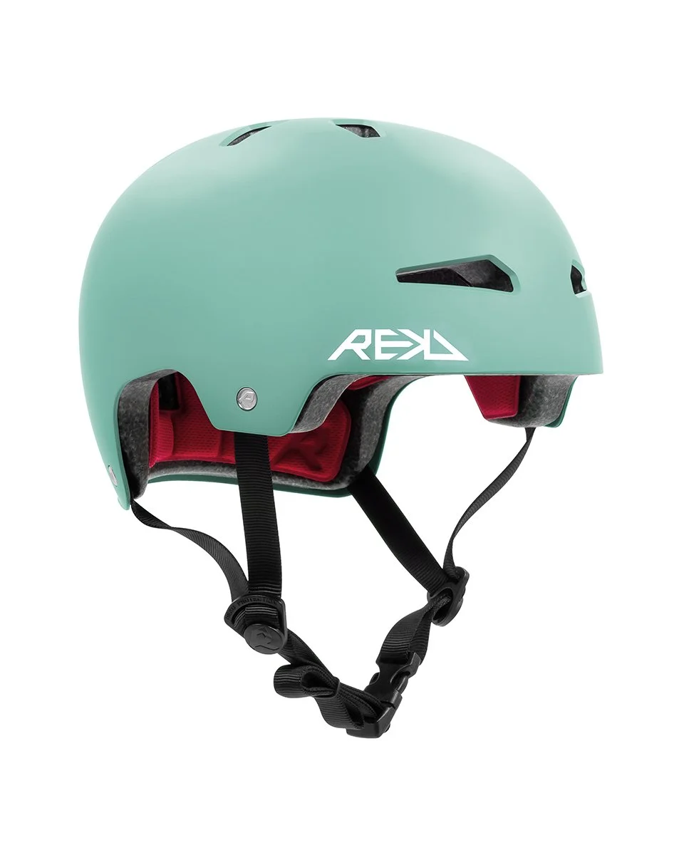 A mint green ski or snowboard helmet with ear pads, black straps, and a red interior lining.