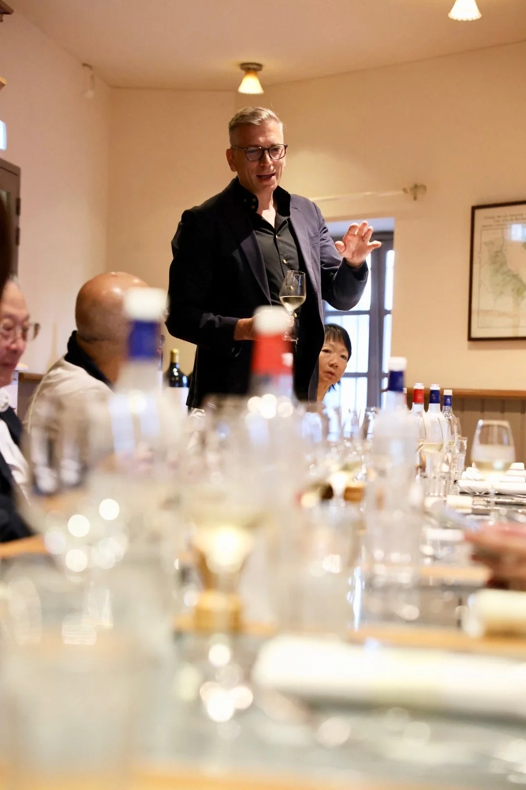 Mark Pygott MW explaining a wine at a large table