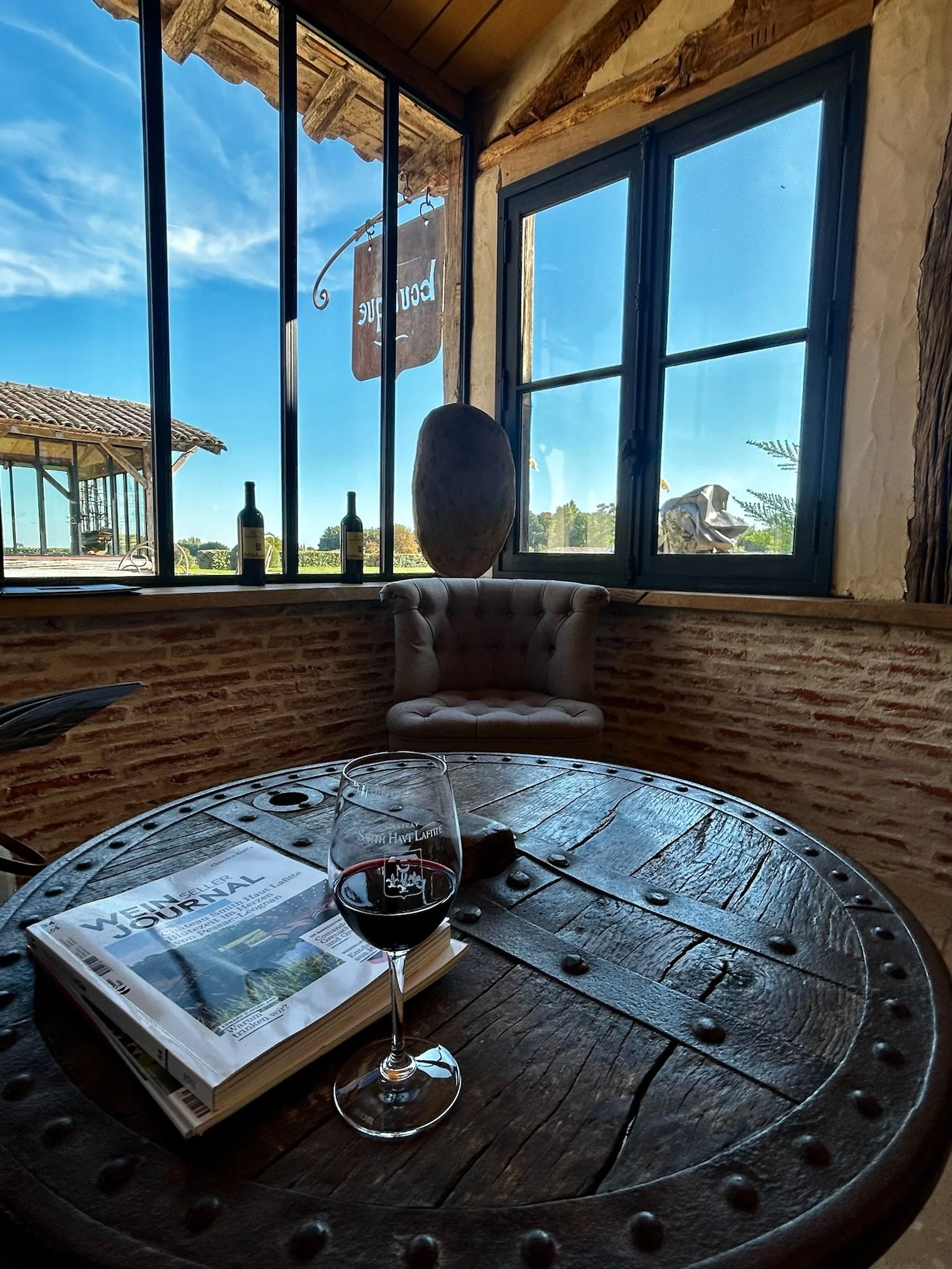 Glass of red wine on antique corner table
