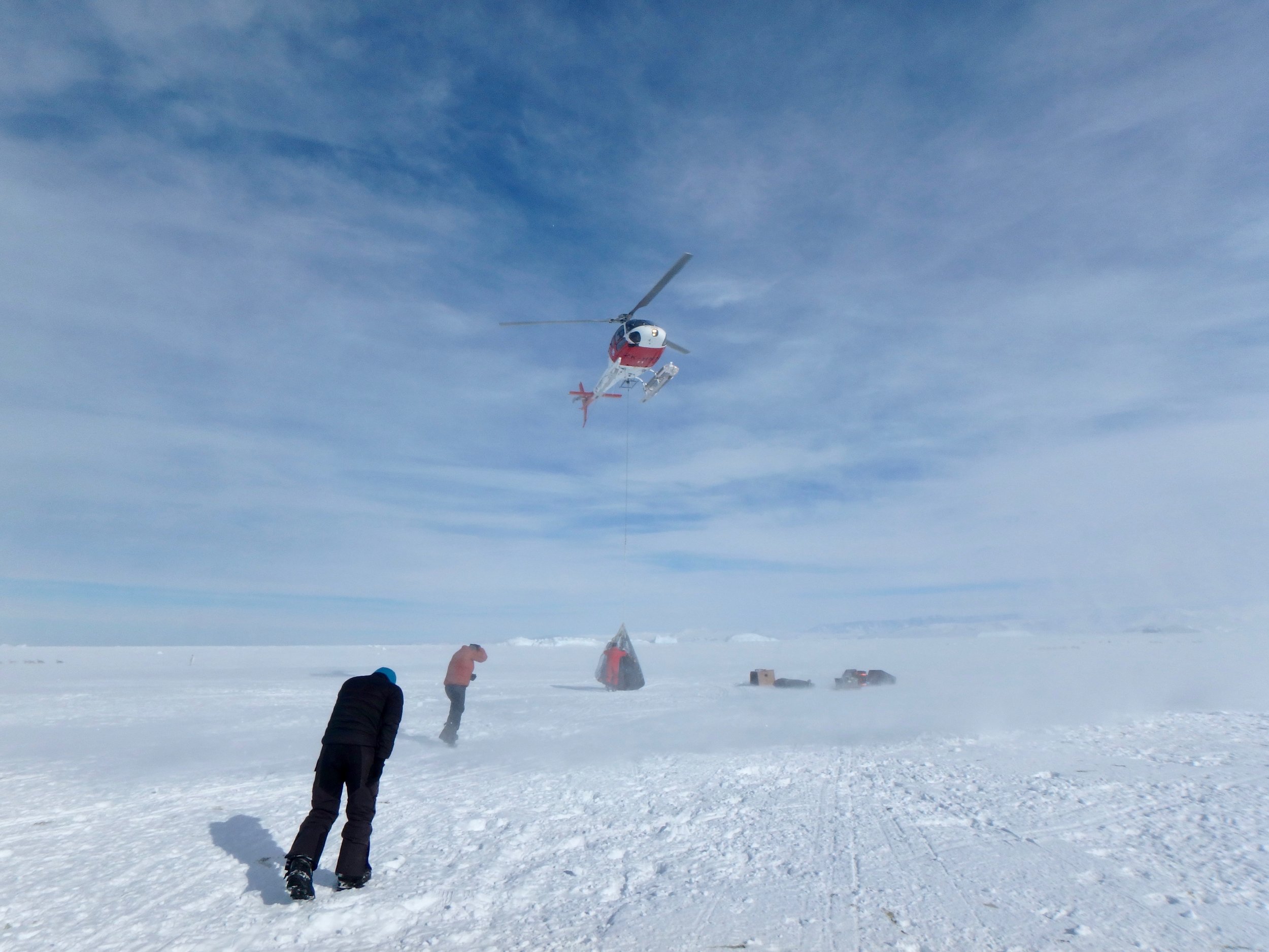 A helicopter delivering field equipment in Antarctica. Copyright Anthony Pyper