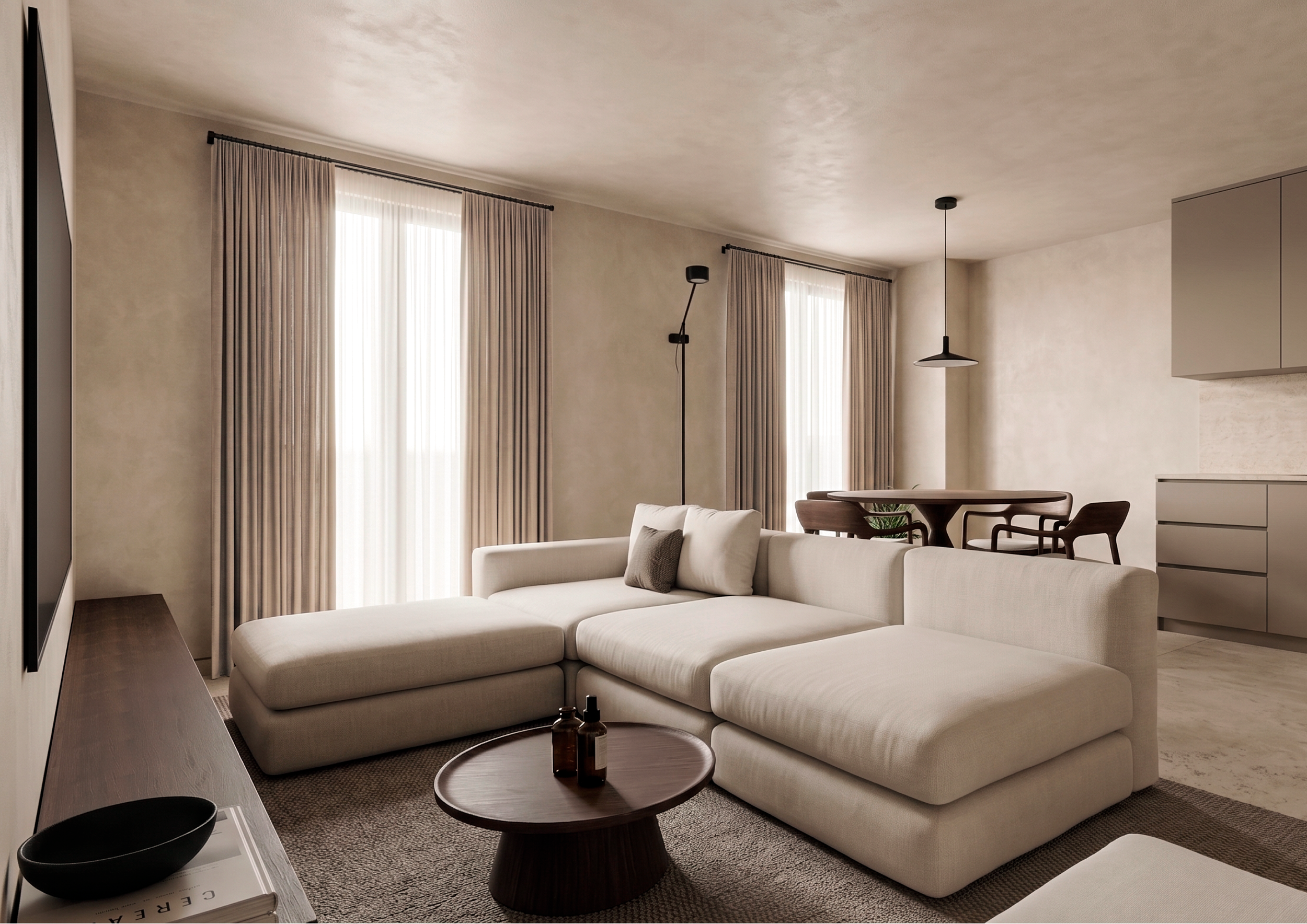 Living room with beige sectional sofa, round wooden coffee table with bottles, tapestry on wall, beige curtains on windows, ceiling lights, and a beige cabinet.