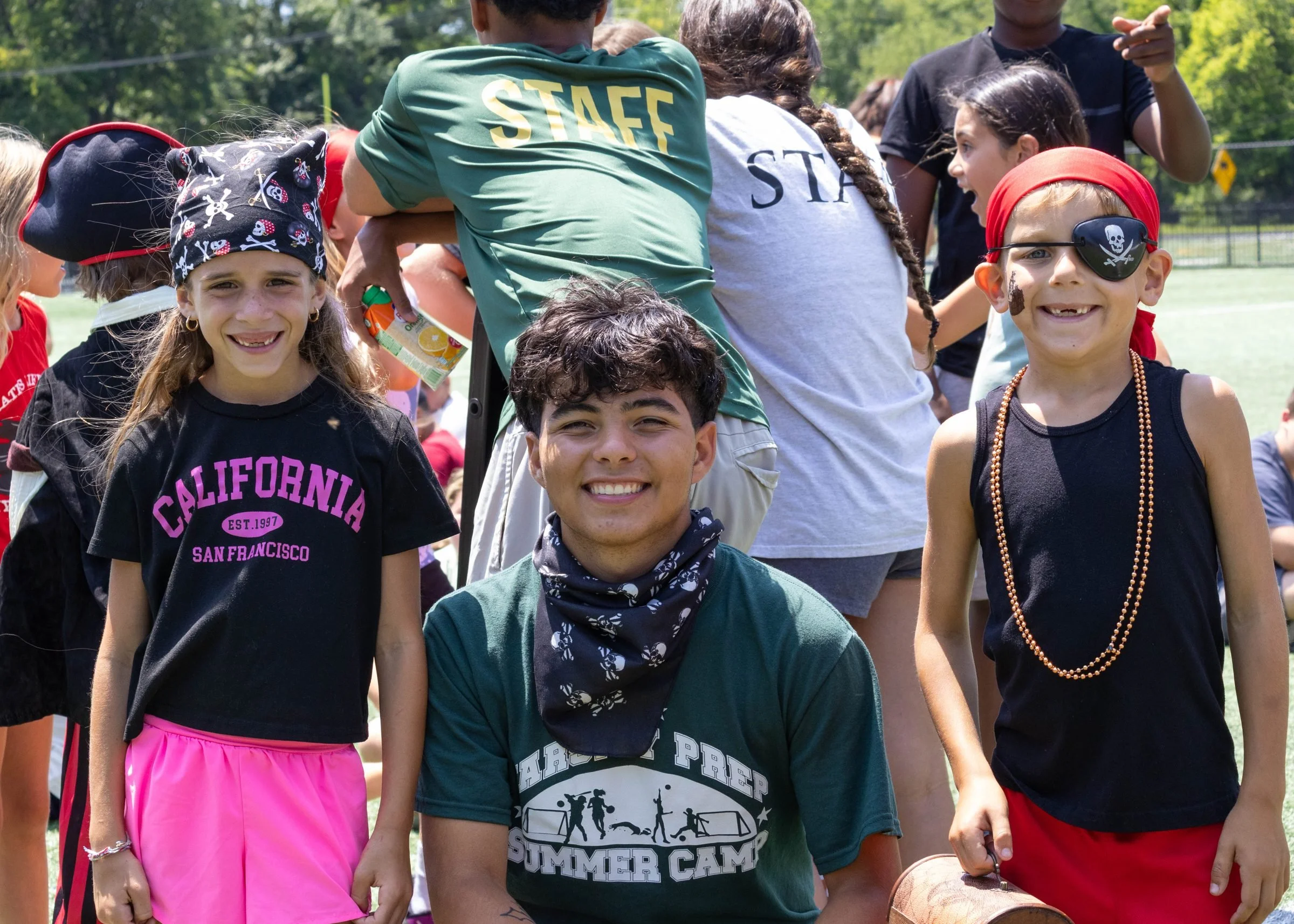 Older campers and a counselor dressed up for theme day
