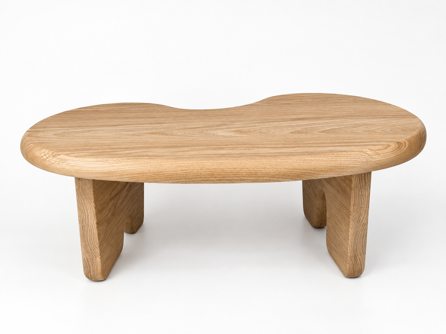 Wooden kidney-shaped table with block legs on a white background.