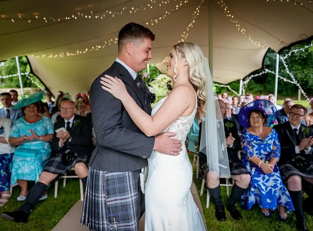 wedding-branxholme-stretch-tent-ceremony-graham-jul23.webp