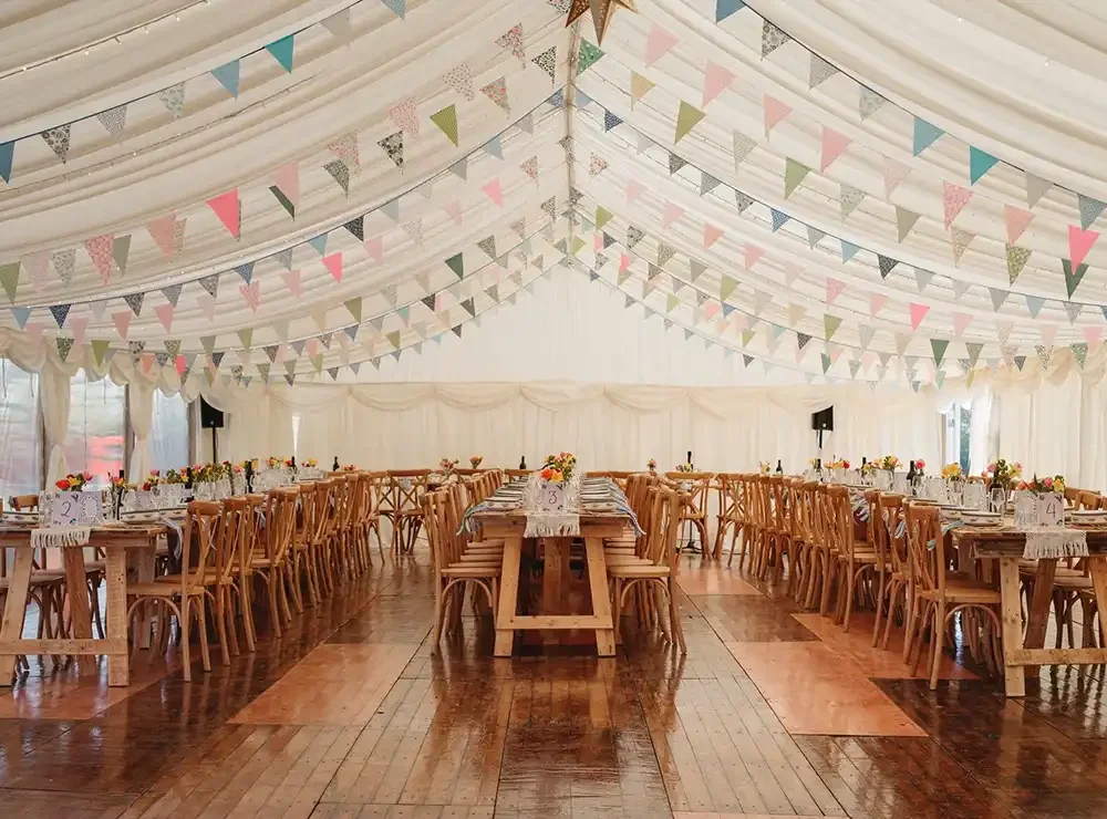 Framed-wedding marquee-interior-summer2025-bunting.webp