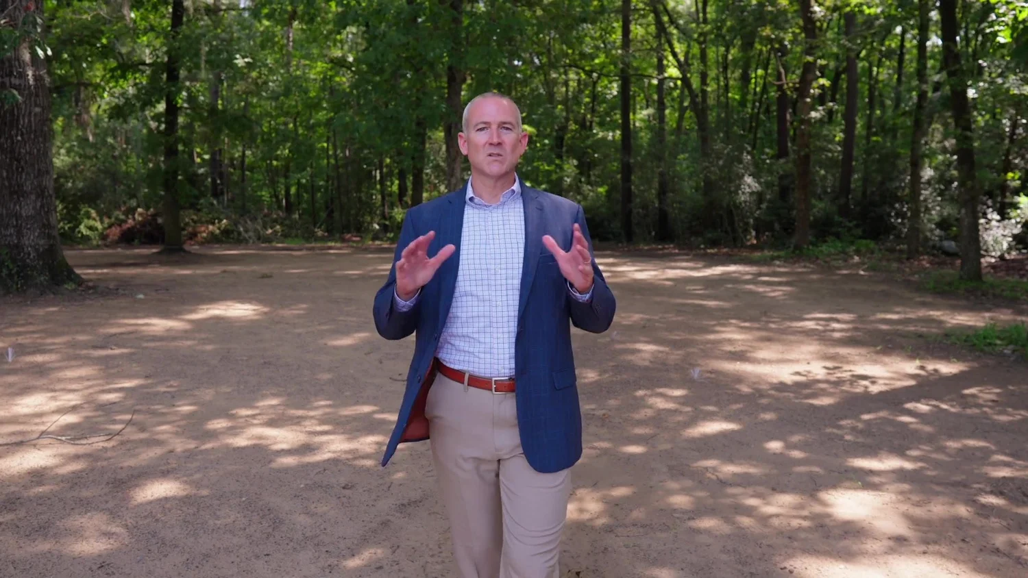 The head of school speaks from Charleston Collegiate’s wooded campus.