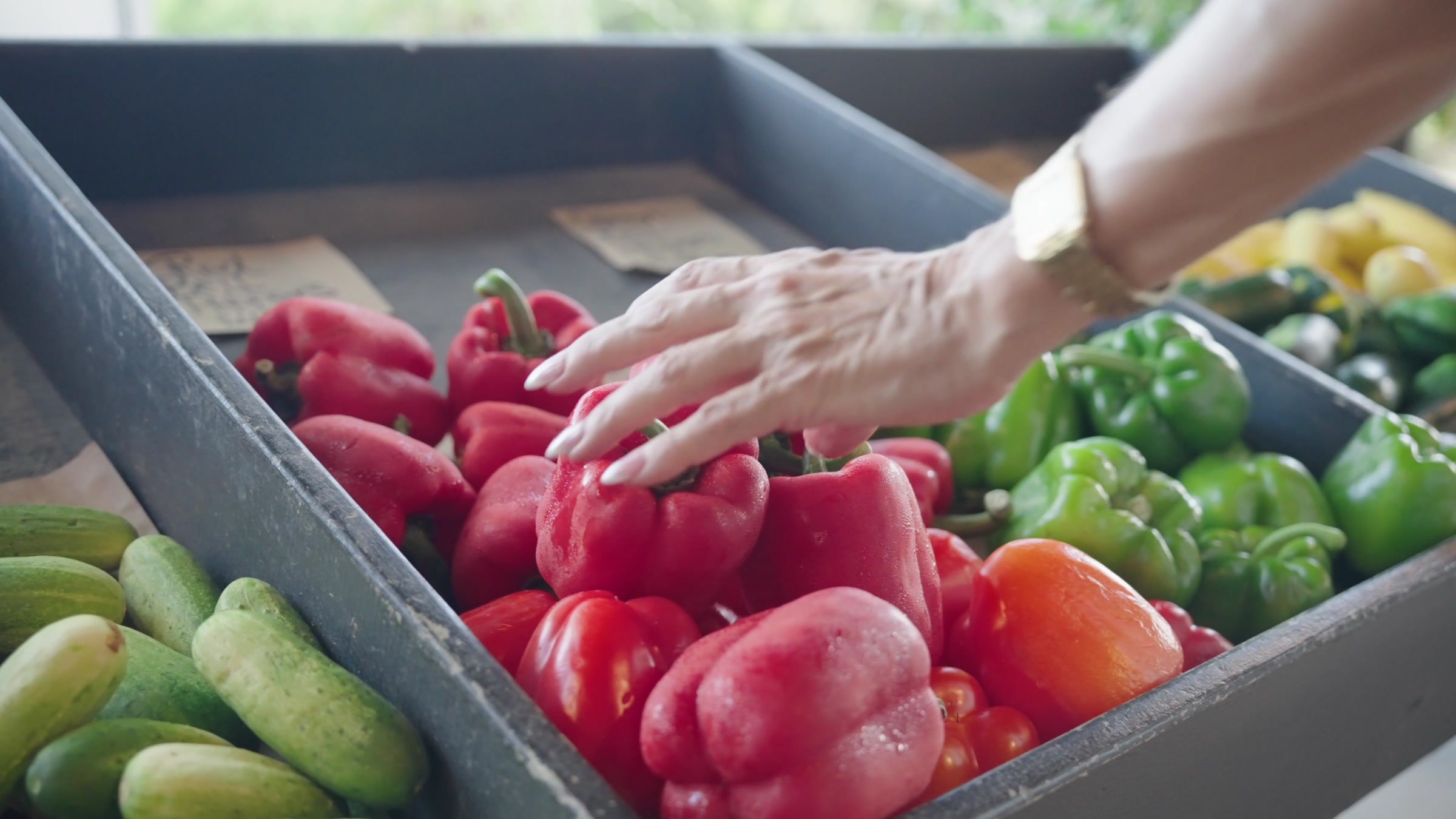 A close detail of selecting fresh produce