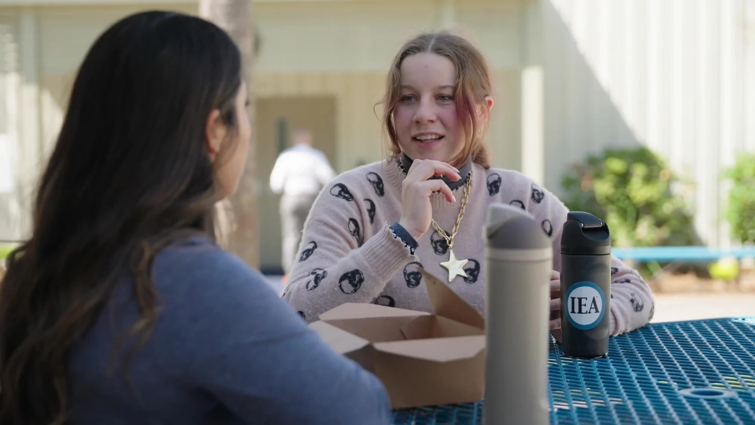 Students share a conversation outdoors at Charleston Collegiate, a frame from Julie’s scholarship film.