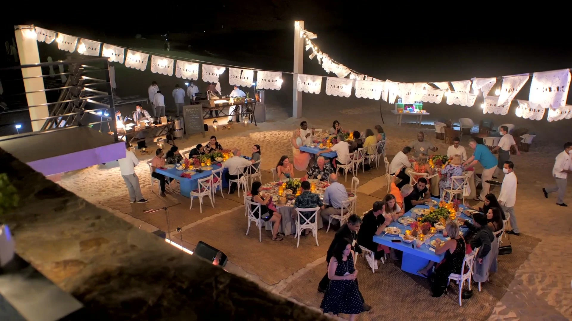 Attendees gathered for an evening Capgemini event by the beach