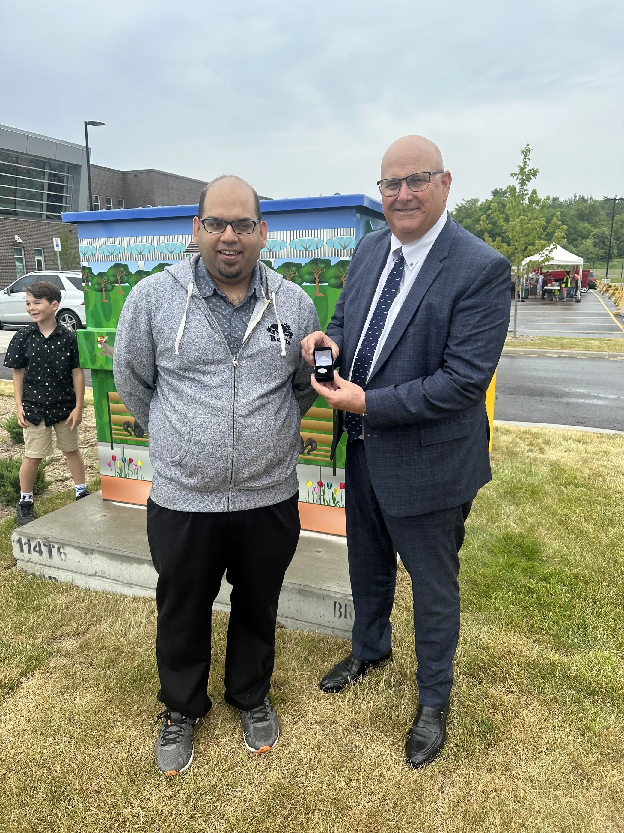 Myself with Mayor Kevin Ashe presenting a city pin