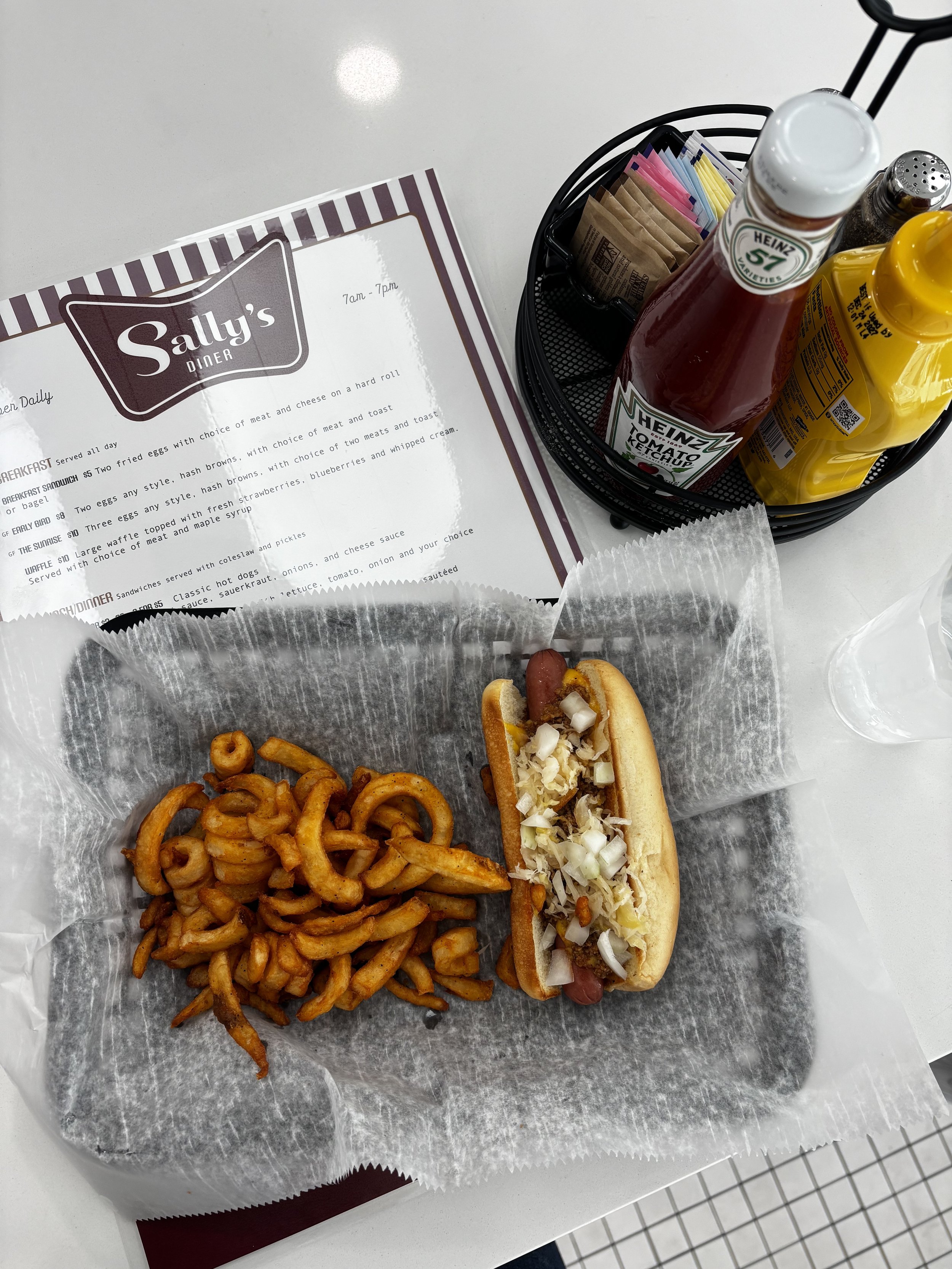 Hot dog loaded with toppings Sally’s Way at Sally’s Diner