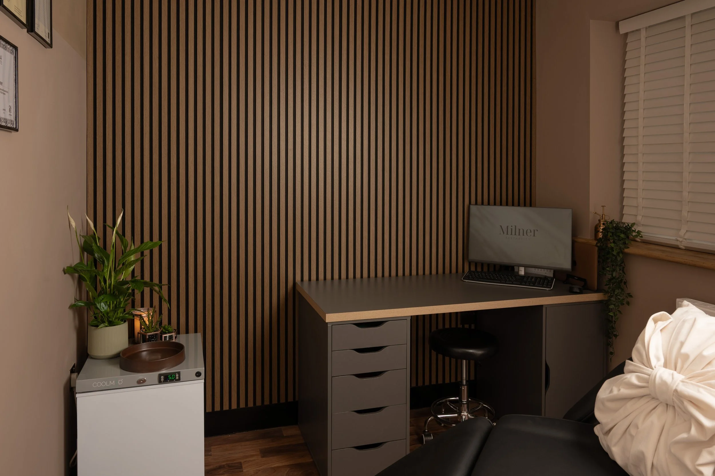 Consultation desk and seating inside the Milner Aesthetics clinic in Halesowen.