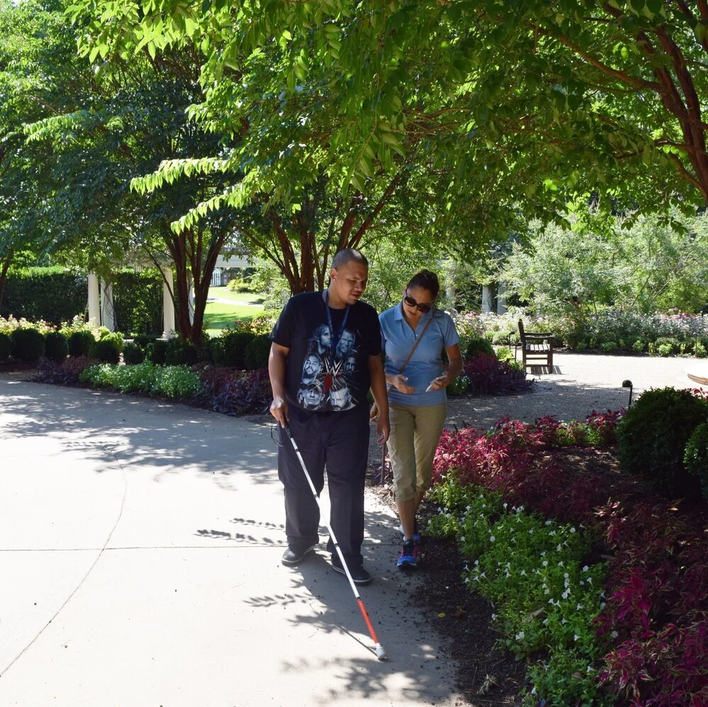 Client and instructor walking side by side outside
