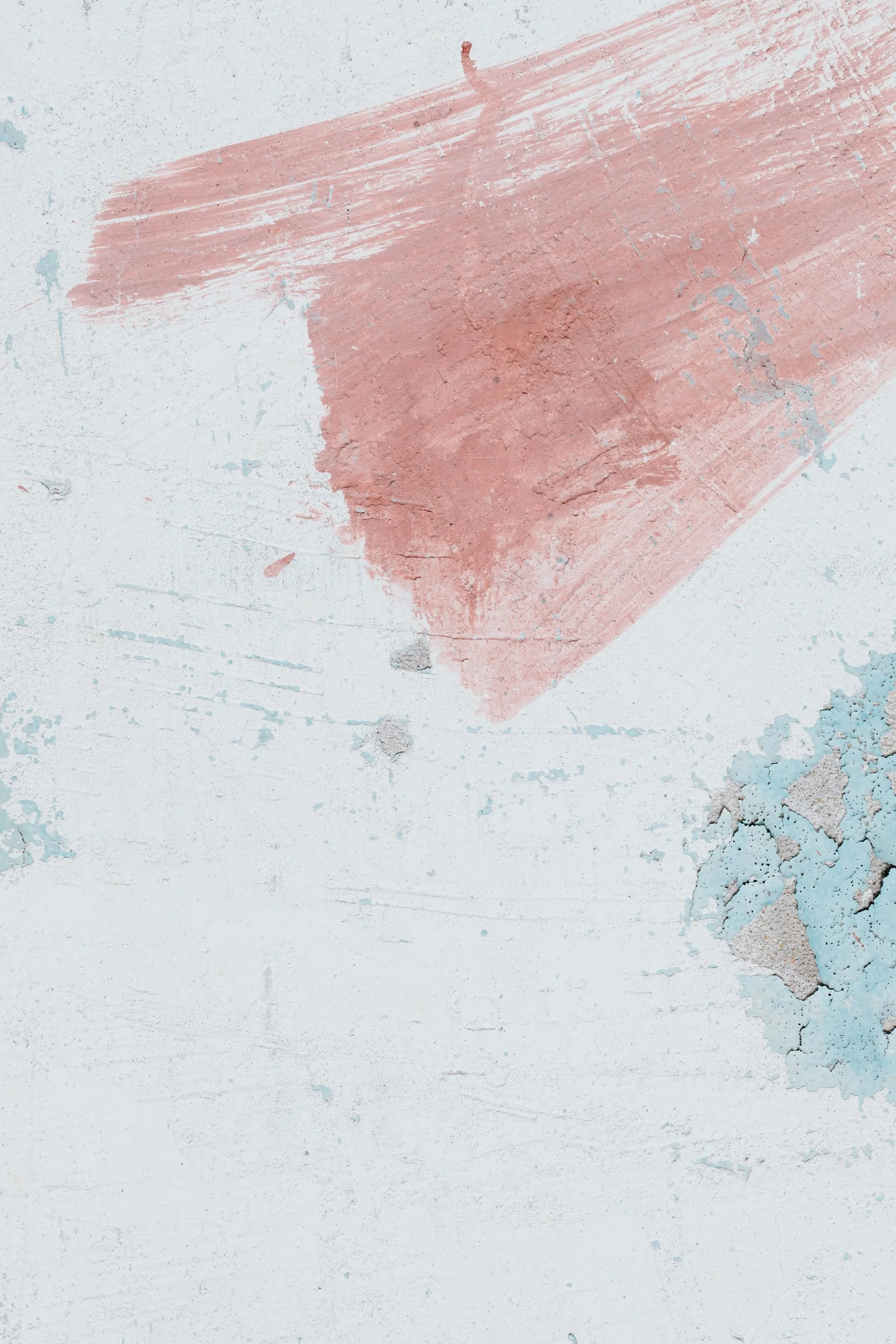Abstract painted wall texture with pink and blue brush strokes