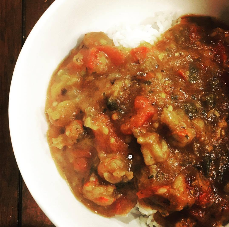 A bowl of Cajun crawfish etouffee and rice.