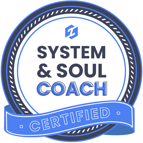 A circular badge with a blue and white color scheme, featuring the words 'System & Soul Coach' and a blue ribbon with the word 'Certified' on it.