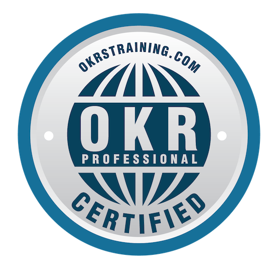 A circular badge with the text "OKR TRAINING.COM", "OKR PROFESSIONAL", and "CERTIFIED" around a globe design, indicating certification in OKR training.