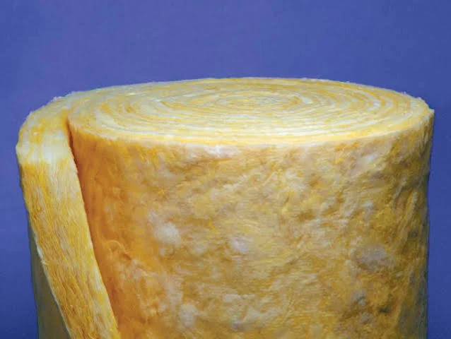 A large, round, yellow grater with a textured surface, used for grating cheese or vegetables.