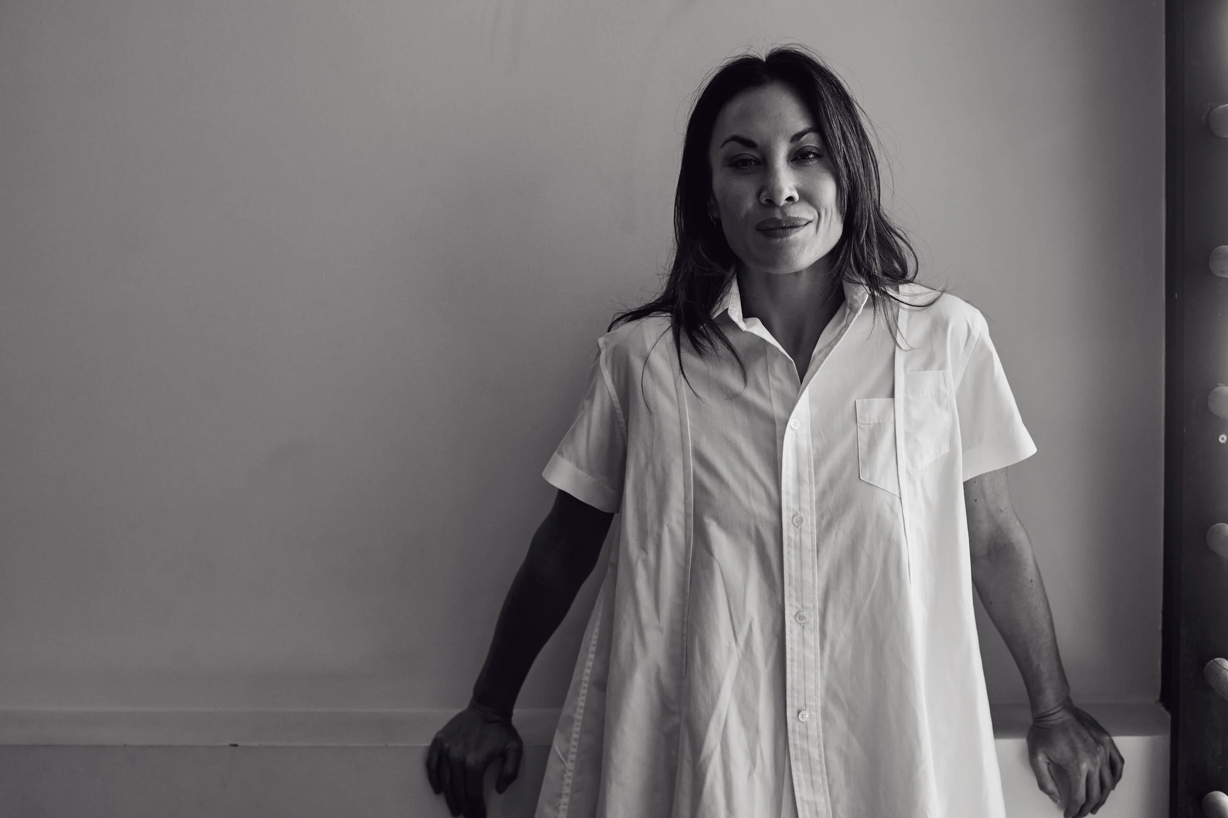 Portrait of Rebecca Tung, founder of Three Elements Health, in a white shirt
