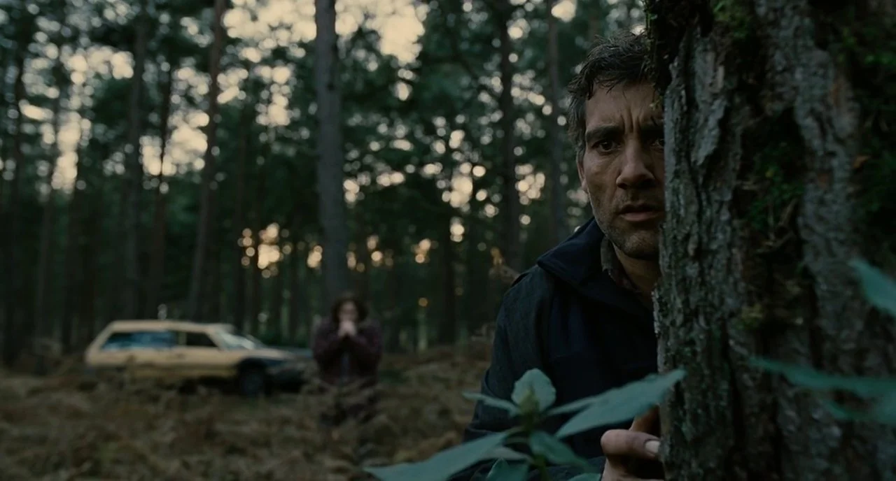 Theo watches from the trees as the Fishes confront Jasper outside his home.
