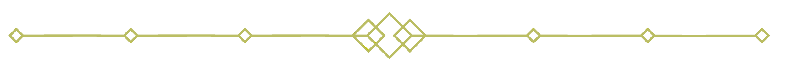 Decorative gold horizontal line with diamond shapes in the center and at intervals.